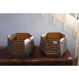 A pair of metal octagonal planters