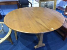 An Ercol Golden Dawn drop leaf dining table, 140cm wide