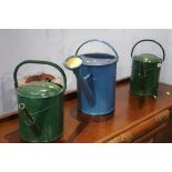 Three metal watering cans