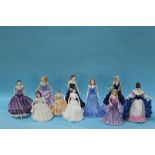 Nine Royal Doulton figurines and a Coalport figure