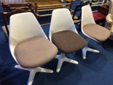 A set of three Maurice Burke for Arkana swivel chairs, number 115