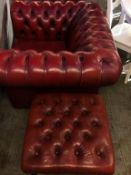 A oxblood Chesterfield club armchair and footstool