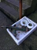 A Belfast sink and water pump