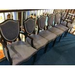 A set of six shield back dining chairs, comprising four single and two carvers