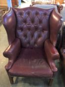 A large Georgian style, button back wing armchair