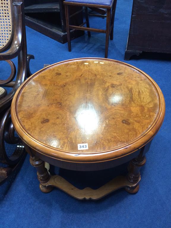 A walnut circular coffee table