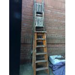 Three sets of wooden ladders