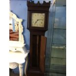 An oak long case clock, with painted dial and thirty hour movement