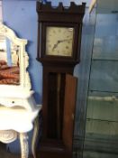 An oak long case clock, with painted dial and thirty hour movement