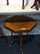 A Victorian walnut and ebonised occasional table