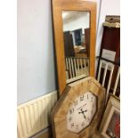 An oak framed mirror and a large clock