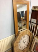 An oak framed mirror and a large clock