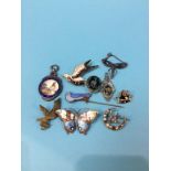 Ten enamelled and other brooches