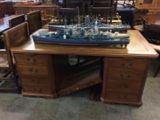 A walnut pedestal desk with green leather inset top and two short drawers. 166cm wide, 94cm long,