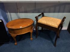 An oval sewing box and a piano stool