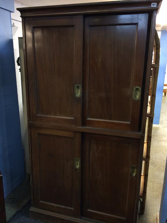 A mahogany school cabinet, with two pairs of sliding doors, 104cm wide, 191cm height and 36cm wide