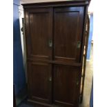 A mahogany school cabinet, with two pairs of sliding doors, 104cm wide, 191cm height and 36cm wide