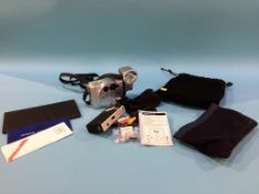 An Olympus O-Product camera, carry bag and instructions and a flip camera
