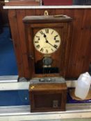 An oak Clocking in Clock