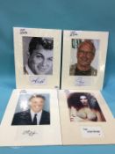 Assorted mounted photos and signed cards, to include Tony Curtis, James Coburn, Nicholas Cage, Chevy