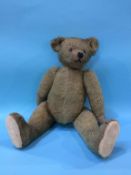 A plush teddy bear, circa 1920s, approx. 51cm high