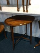 A mahogany oval occasional table