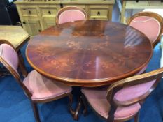 An Italian style circular table and four chairs