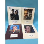 Assorted mounted photos and signed cards, to include Dan Aykroyd, Kevin Bacon, Billy Crystal, Denzel