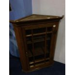 An oak corner cabinet