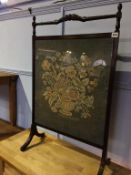 A mahogany fire screen