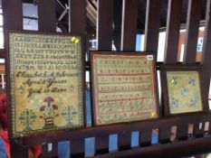 Two samplers and a needlework panel