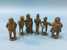 A collection of brass miniature Dickens figures