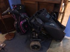 An electric golf trolley and a golf bag