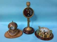 A reproduction Ships clock, a clock inset into a Divers helmet and a Ships Telegraph lamp (3)