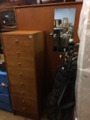 A teak wardrobe and a narrow chest of drawers