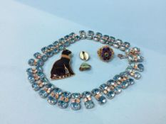 A decorative necklace, Cat brooch, enamelled ring and a pair of clip earrings