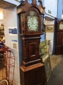 A mahogany long case clock, with eight day movement, painted dial, two subsidary dials, by G. E.