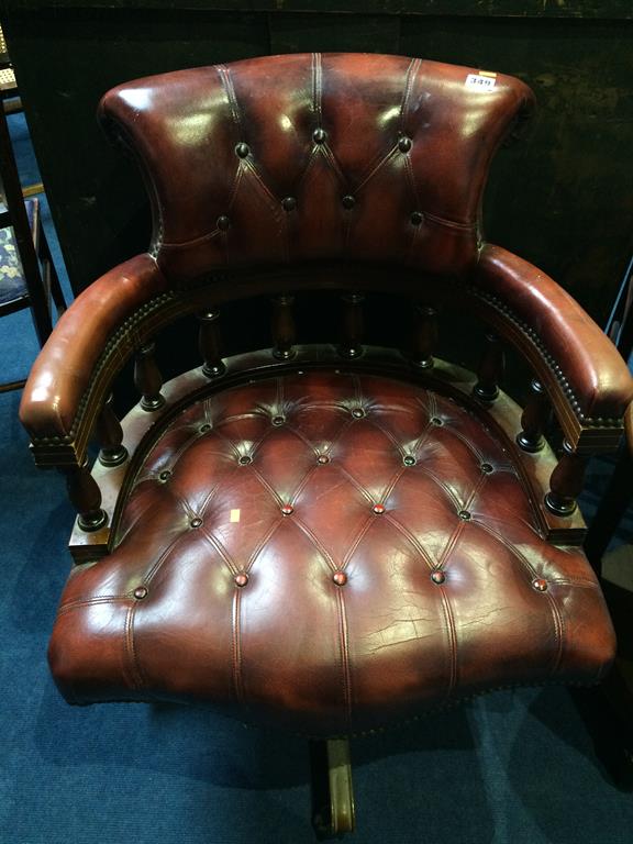 A Chesterfield brown office swivel chair