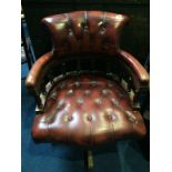 A Chesterfield brown office swivel chair