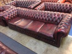 A Chesterfield oxblood four seater settee