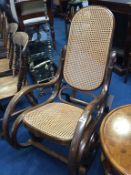 A Bentwood style bergère rocking chair