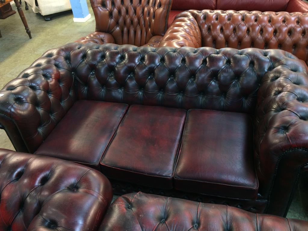 A Chesterfield oxblood three seater settee