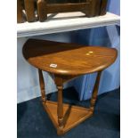 A Jaycee oak half moon side table