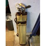 A quantity of vintage golf clubs