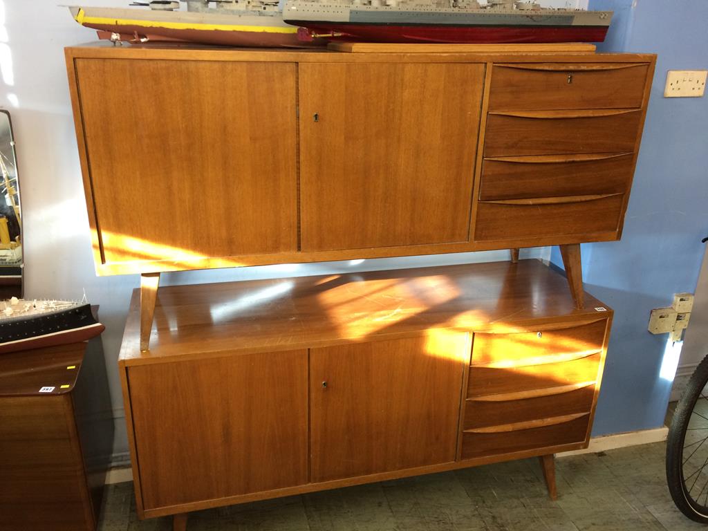 Two teak sideboards and a two door cabinet