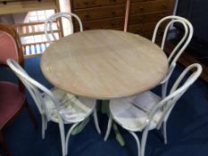 A modern table and four Bentwood style chairs