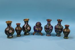 A small Chinese bronze vase with flared rim, 15cm height and a selection of cloisonne enamel vases