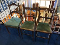 A pair of oak chairs and a single Edwardian chair
