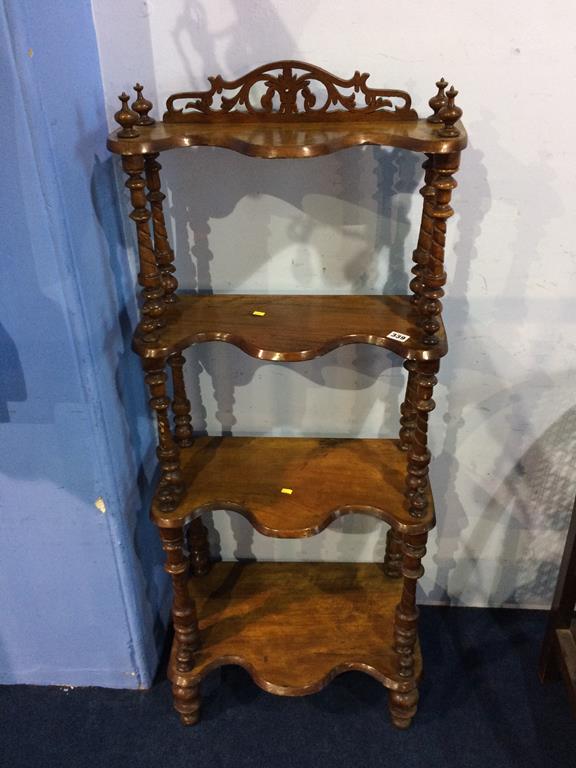 A Victorian walnut four tier what not