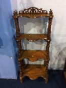 A Victorian walnut four tier what not
